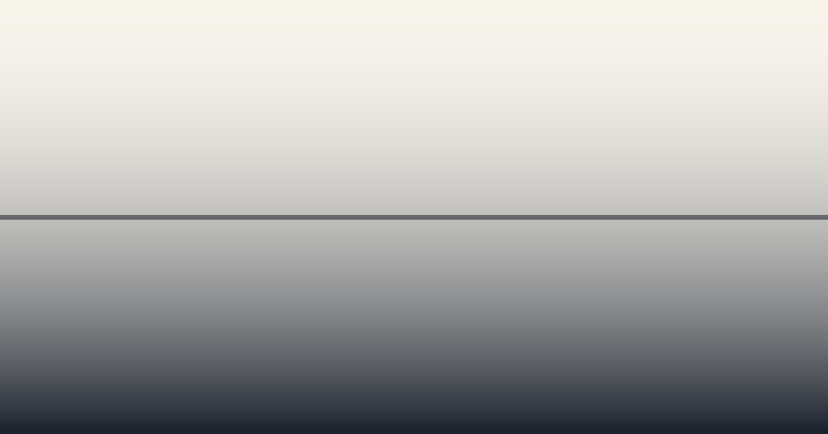 A quiet modern technology workspace at dawn, monitors dark, soft directional light falling across an empty desk.